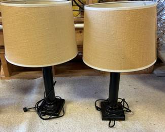 Nice pair of black lamps with beige shades.