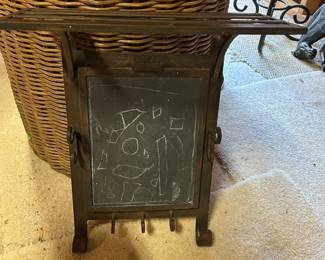 Cast iron key holder with a shelf.