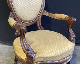 Antique Upholstered Parlor Chair On Casters
