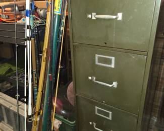 Fishing poles, metal file cabinet