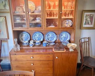 Drexel MCM china cabinet c. 1960. Lighted top with glass doors. Bottom has pullout shelf and drawers and cupboard.  