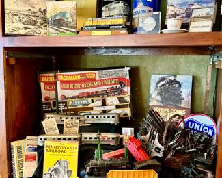 FOUR SETS OF TRAINS.  RAILROAD BOOKS, OLD RAILROAD TIMETABLES.