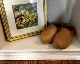 Framed art and wooden dutch shoes