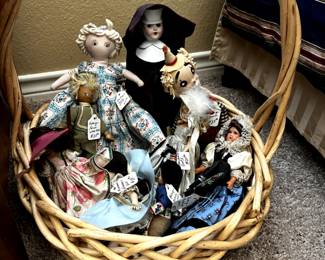Basket of vintage doll collection