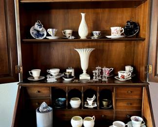 What a lovely collection of unique vases and cup/saucer sets.