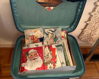 Old greeting cards 
Blue vanity suitcase 