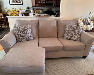 Comfy Couch - note: there is some black fuzz on a cushion that came off of a sweater or blanket. Easily removed - I will try to get it off before the sale, but just in case I wanted to say that it is NOT a stain.