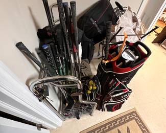 More golf items including a cart bag and storage caddy