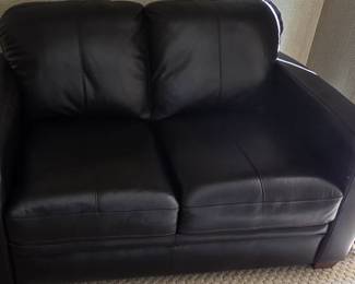 Beautiful brown leather loveseat is excellent condition