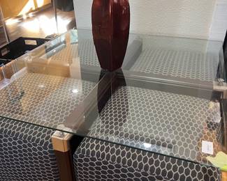 Glass coffee table with upholstered cubes stored within