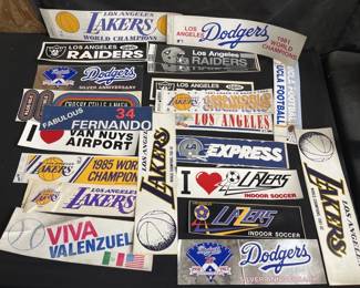 Lot # : 518 - Lot of Lakers, Raiders, and dodgers bumper
stickers