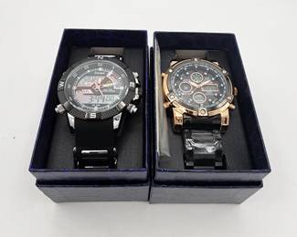 Lot # : 385 - Pair of new 48mm men's Stauer watches in original packaging, working.
