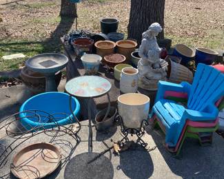 Lots of flowers pots and lawn ornaments