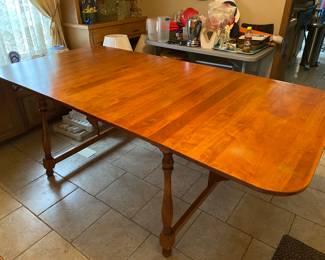Solid wood dining table with 2 leaves