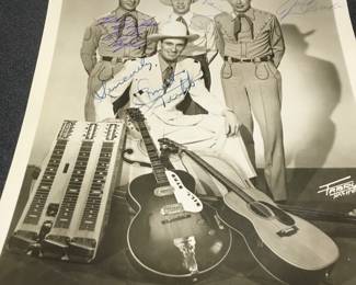Earnest Tubb and his band, all signed
