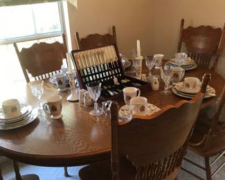 Claw footed table, pressed back chairs seating for 6, extra leaf.