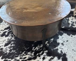 Table and cowhide rug