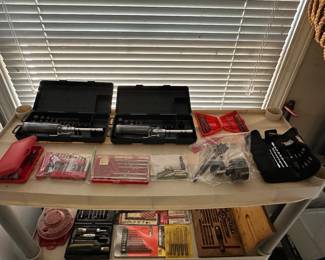 Drill bits, screw driver with various bits.