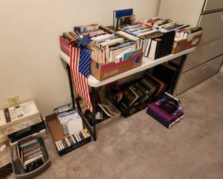 Filing cabinets, books, another desk