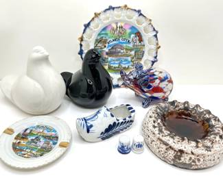 Blown Glass Elephant, 2 Souvenir Plates, Dutch Clog, Thimbles, Ikea Birds & Vintage Ashtray
Lot #: 174