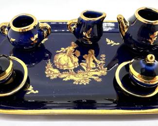 Vintage Limoges French Miniature Tea Set With Gold Accents
Lot #: 43