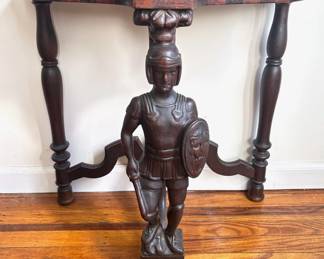 Vintage Solid Wood Demilune Table With Inlaid Top & Carved Warrior Figure
Lot #: 37