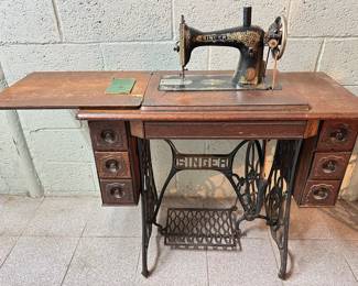 Antique 1920 Singer Sewing Machine Numer 15 In Original Wood Cabinet With Iron Foot Pedal
Lot #: 21