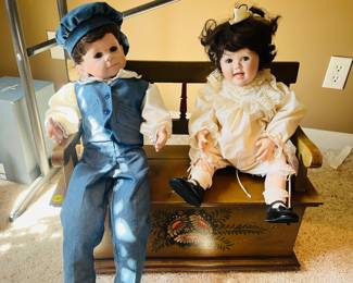 Vintage porcelain dolls
Wooden doll storage bench 