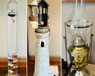 Vintage Galileo glass thermometer 
Vintage cast iron lighthouse candle holder 
Vintage brass oil lantern lamp 