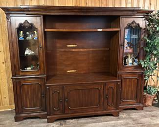 Entertainment center with side cabinets.