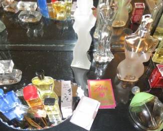 Large collection of perfume bottles, most empty