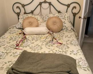 Bed with brass headboard