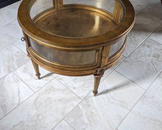 gold circular display/coffee table. Great to display a collection, etc