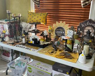 Bumble Bee Decor.  Also, New cookware set in box and new dishes, in box, below the table.