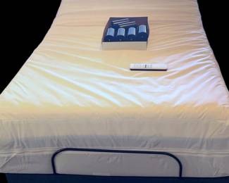 Twin adjustable bed with barely used deluxe mattress 