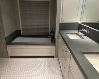 Koehler Bathtub, Soapstone countertops, custom cabinets.