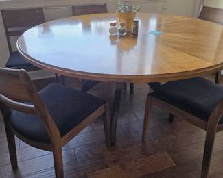 60" round dining table seats 6. Chairs sold separately. 