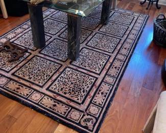 Glass top dining table, area rug