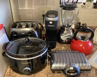 Crockpot,toaster, blender and a waffle maker.