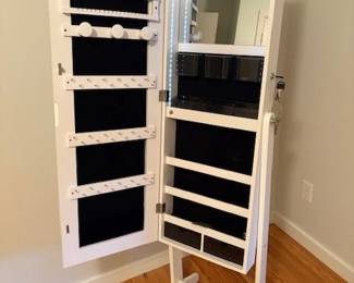 Standing vanity mirror with jewelry/makeup cabinet