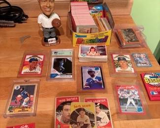 Assorted Collectors cards, bobbleheads, and more.  Includes Ken Griffey Rookie, Bo Jackson 'future stars', mis-printed Topps card, unopened 1990s baseball packs, 1950-70 rare collectors cards, bobble heads and more