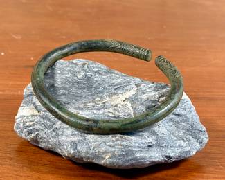 An ancient bronze bracelet or arm band, possibly from the Khmer civilization. Incredible detail and weight, weighing approx. 117.56 grams and measuring 11” round.