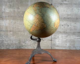 An antique 12” globe on an iron stand, manufactured by Weber Costello Co. This globe measures on the stand, 20” H x 12” W x 12” D. The Weber Costello Company was a Chicago-based globe maker and school supplier that produced globes and chalkboards. They were known for their high-quality craftsmanship and attention to detail.