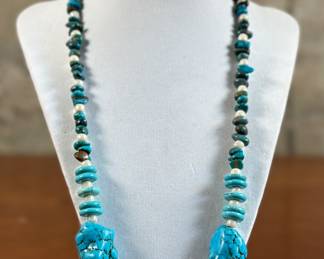 A stunning Native American Turquoise & genuine Pearl necklace with a silver clasp measuring 24”.