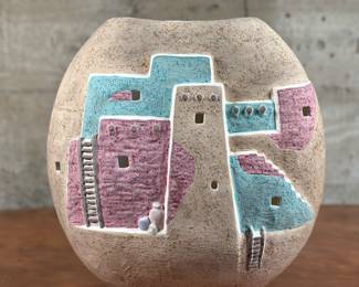 “Adobe Home Landscape”, a stunning Native American pottery vase in very good condition. This vase measures 13” H x 13” W x 6” D.
