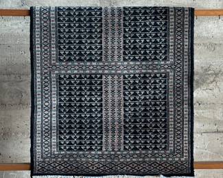 An antique hand knotted Oriental Hatchlu rug, made of 100% wool in Pakistan. Maker tag present underneath as shown in photos. This hand knotted Oriental rug made in Pakistan measures 48” x 31.5”. A Hatchlu rug is a rug with a unique design that’s part of the Enssi family of rugs. The design is characterized by a cross-shaped band that divides the rug into four quadrants. Each quadrant contains rows of small Y-shaped motifs.