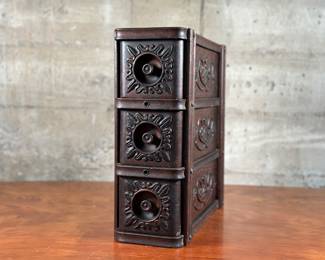 A beautiful set of antique sewing machine drawers with wonderful detail throughout. All three drawers slide smoothly as they should. This stack of drawers measures, 15” H x 6” W x 15” D.