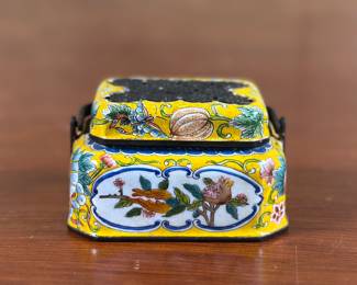 An antique yellow Chinese enamel hand warmer. Features stunning detail and is signed underneath as shown in photos. These items would sometimes contain a copper insert for holding coals (this one does not). These small, portable devices were often crafted in round or oval shapes for easy handling and adorned with lacquer, bronze or enamel.
