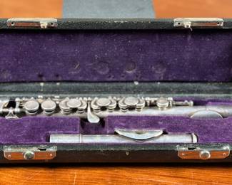 An antique Piccolo in a purple velvet lined case by, Leon Aubert. Maker marks present as shown in photos and appears to be complete. A piccolo is a small flute that plays an octave higher than a regular flute. It’s a member of the woodwind family of instruments. This Piccolo is believed to be a D-Flat.