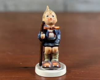“Little Hiker”, Goebel Hummel figurine, made of porcelain and in very good condition. Made in West Germany and stamped underneath as shown in photos. Goebel acquired rights to turn Hummel’s drawing into figurines, producing the first line in 1935. The figurines were introduced at the Leipzig Trade Fair, a major European show for the industry. Goebel was known for presenting new and novel products that attracted American distributors.